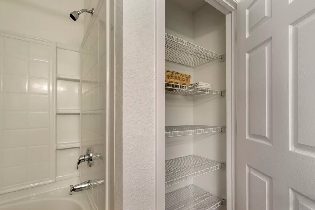 Linen closet located in bathroom